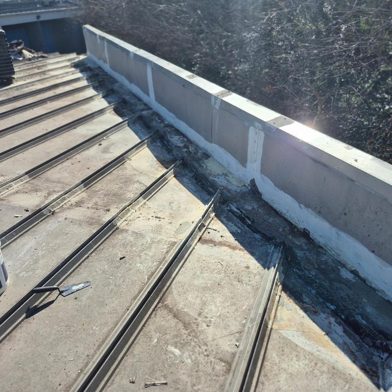 Metal Roof Leak Repair at Wall Tie-In Fluid Applied System in South Charlotte project photo 1