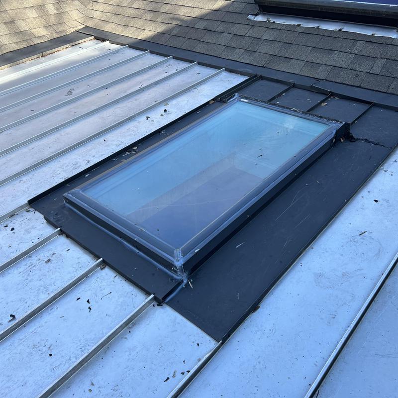 Charlotte, NC Roof Inspection - The skylight on the metal project photo 4