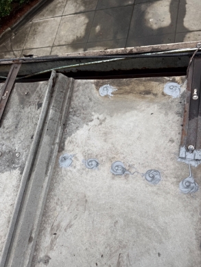Commercial Metal Roof Fastener Sealing and Gutter Outlet Clearing – Charlotte, NC project photo 2