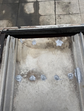 Commercial Metal Roof Fastener Sealing and Gutter Outlet Clearing – Charlotte, NC project photo 3