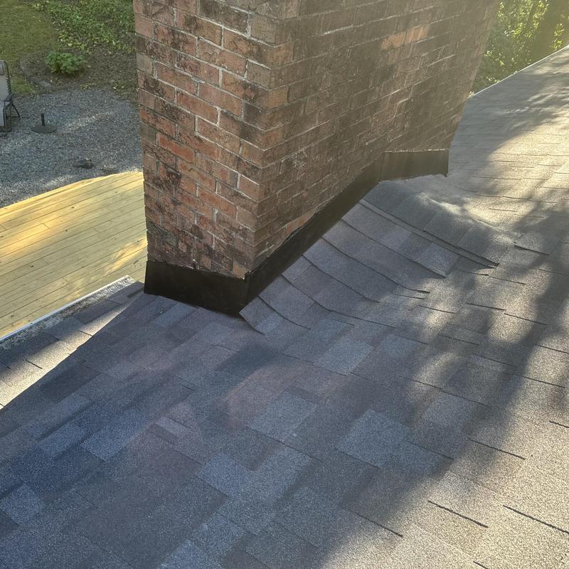 Roof Replacement in Charlotte NC Chimney Reflash, Ice & Water Shield Valleys, Owens Corning Duration Shingles project photo 2