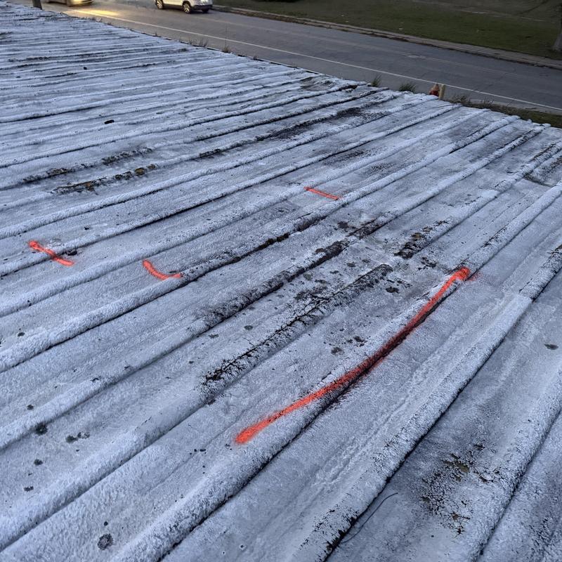 Roof-to-Wall Leak Repair on SPF-Coated PBR Metal Roof | 120,000 SF Facility project photo 3