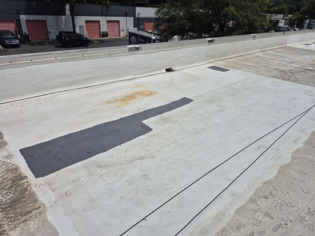 Commercial Deteriorated Membrane Repair and Silicone Coating – Charlotte, NC project photo 1